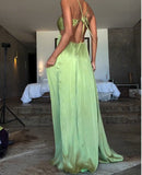 Back view of the elegant green backless resort gown showing the halter tie.