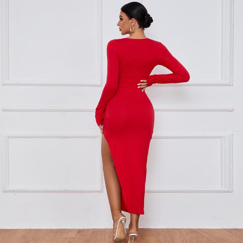 Model in a red long sleeve cocktail dress with a chest cutout.